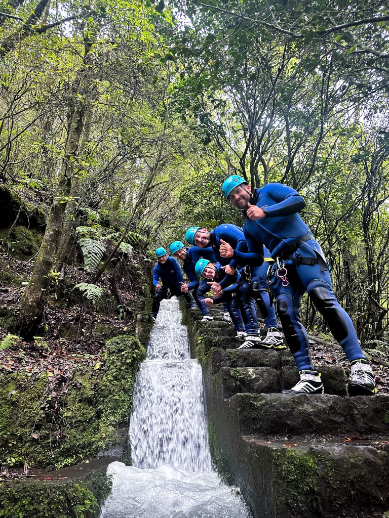Group hiking through a mountain stream