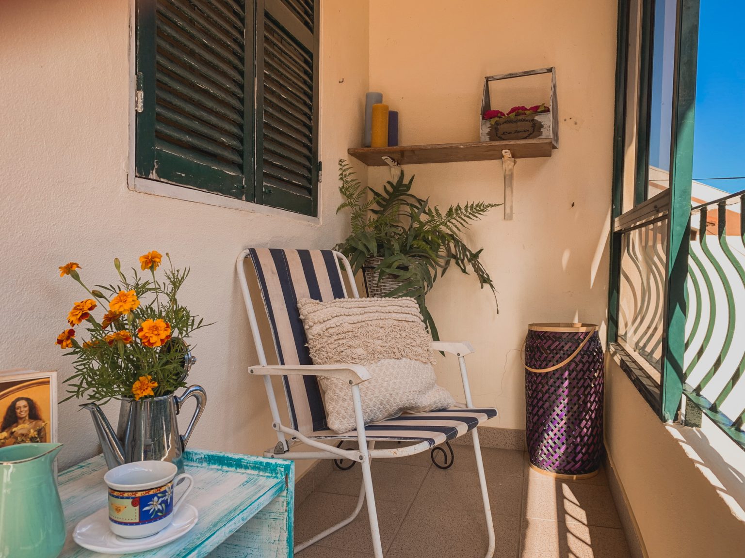 Balcony with flowers at the Eco-CoLiving house