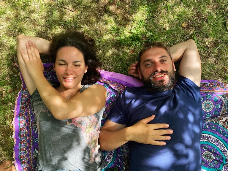 Two community members relaxing on the grass